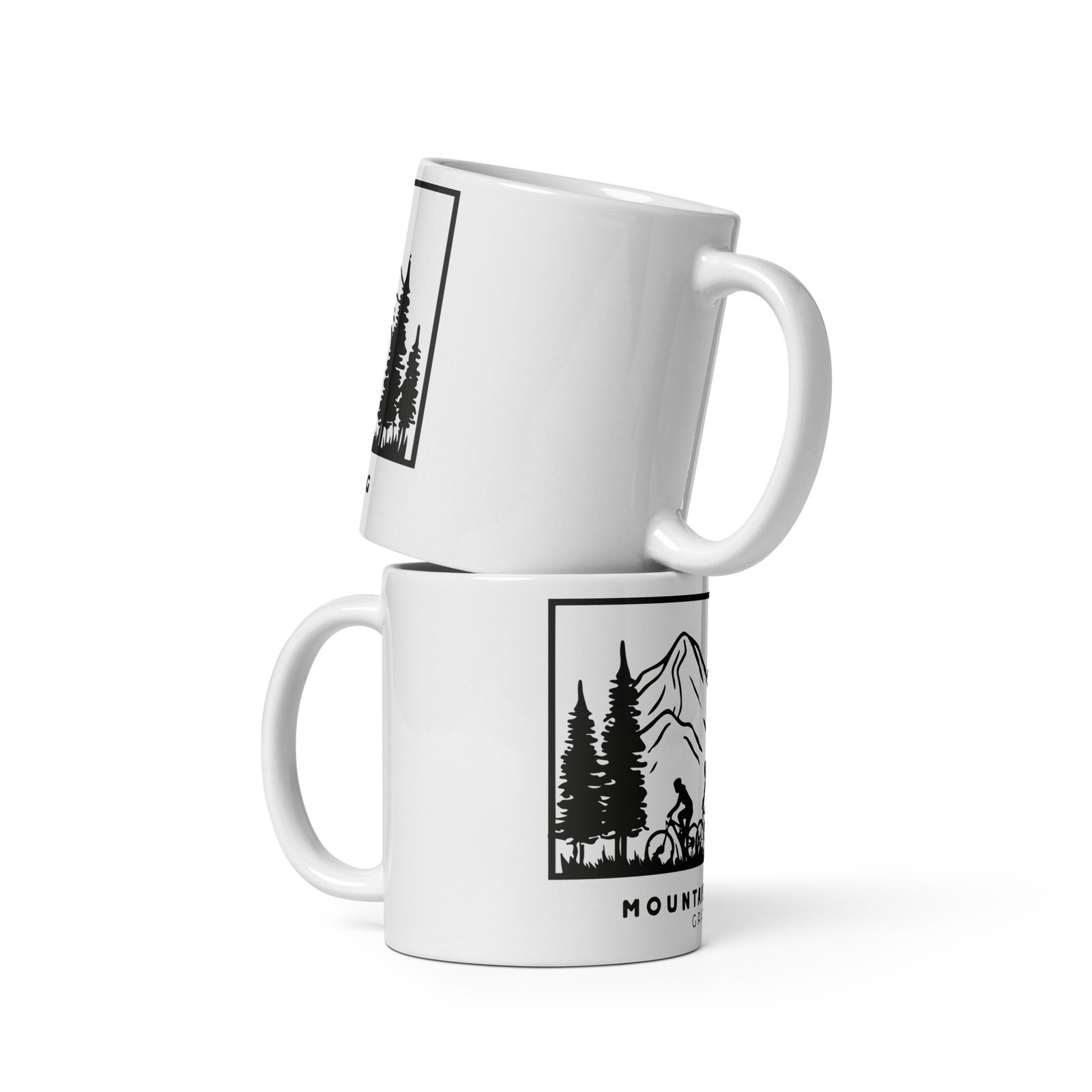 Dos tazas Mountain Biking Gravel apiladas, con diseño de ciclistas y paisaje montañoso, sobre fondo blanco.